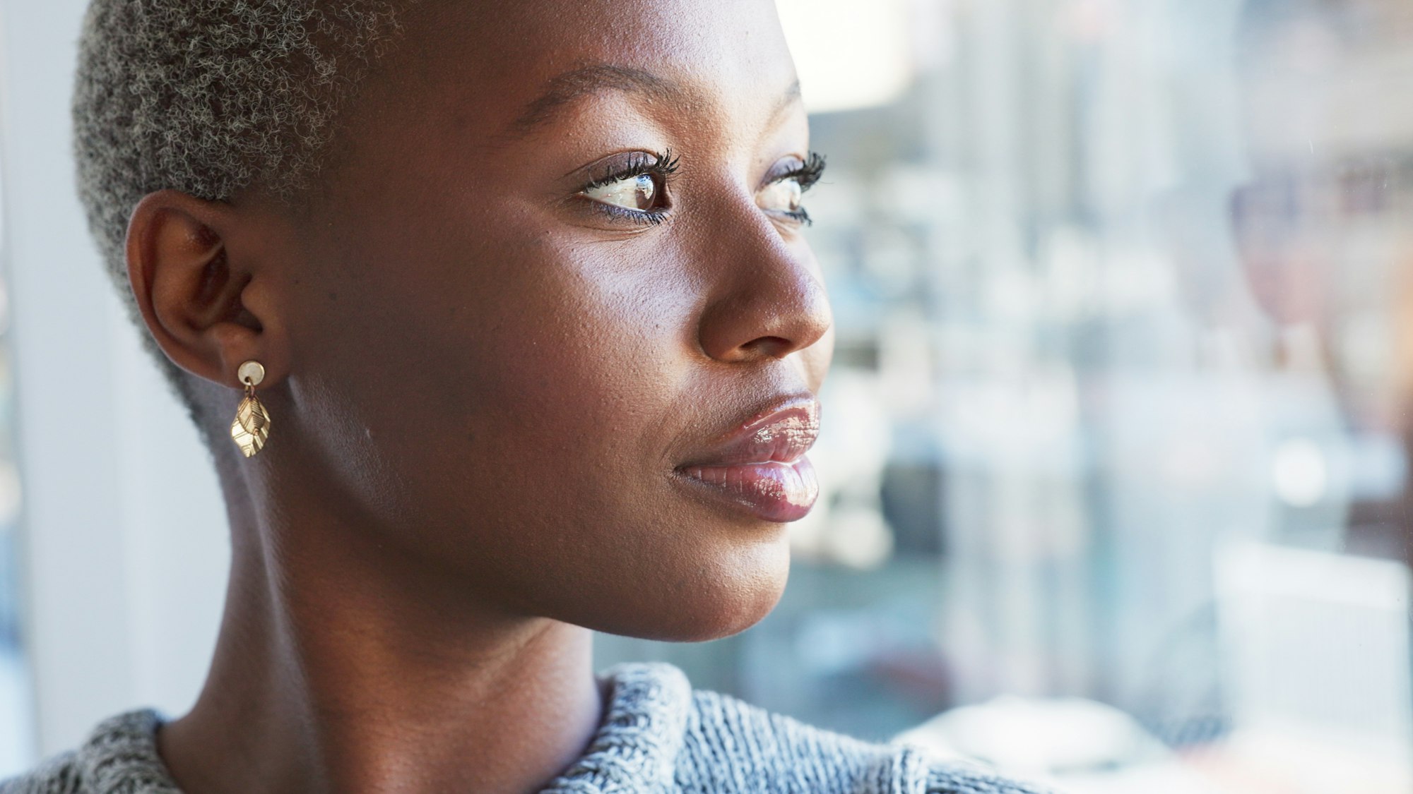 Professional black woman thinking while sitting in her office with ideas and planning marketing pro